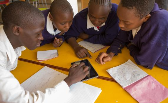 Students sharing a tablet