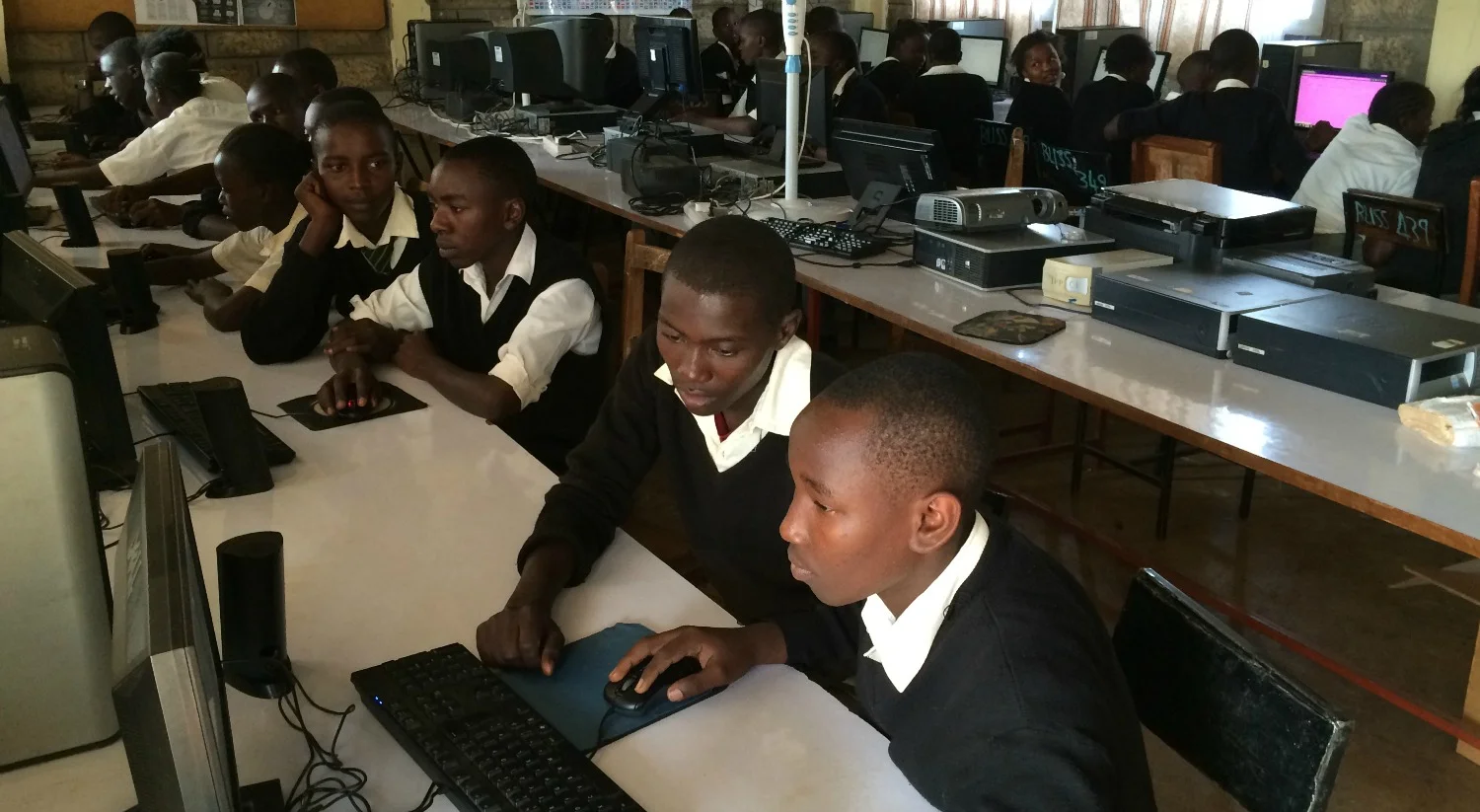 Students using computers in an urban school